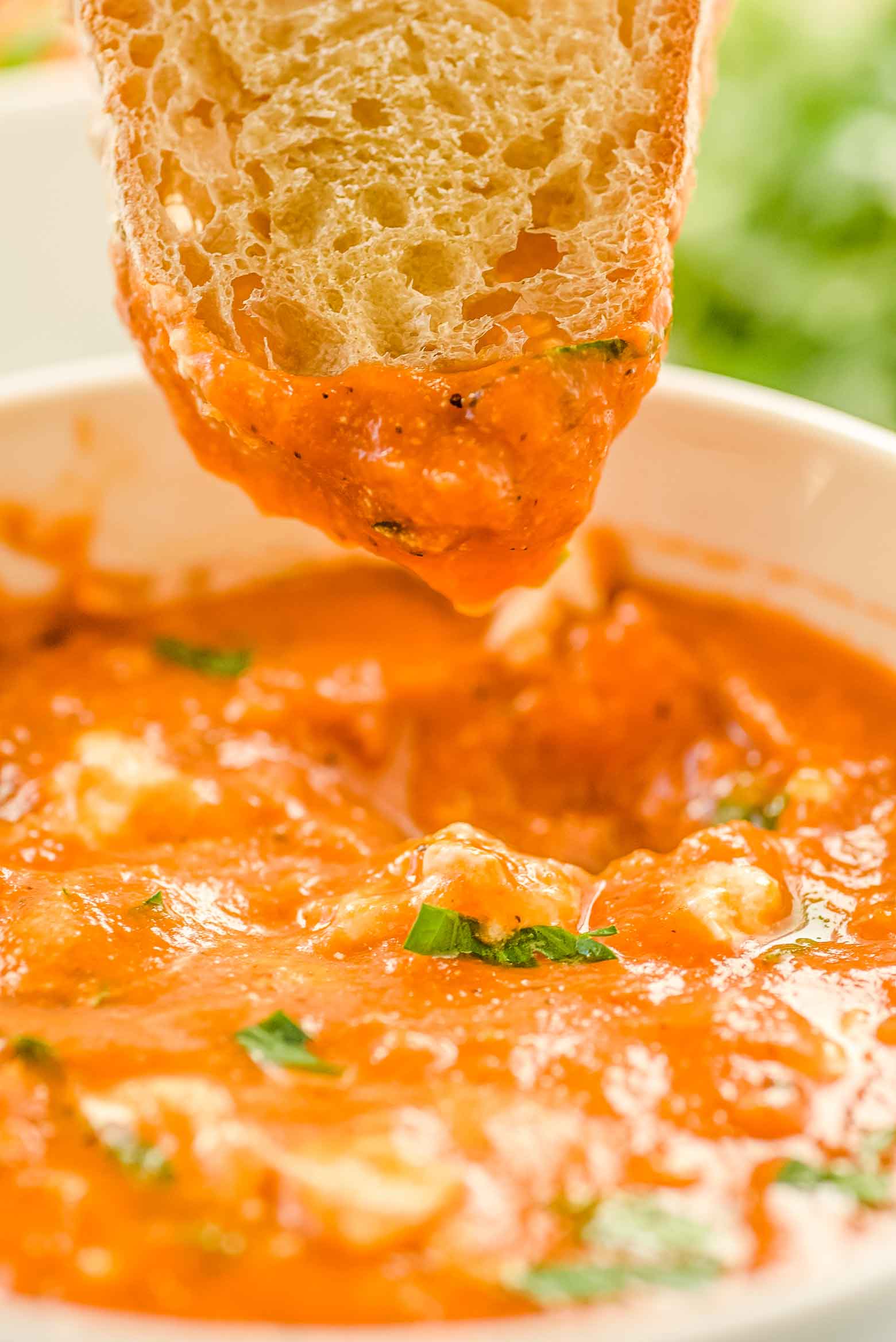 Roasted red pepper tomato soup is a warm, healthy, and hearty meal on a cold winters night. Roasted red peppers and lentils loaded with protein, vitamins and minerals will leave your body happy, while the taste will leave your taste buds happy.  Made in an Instant Pot or other pressure cooker, it's ready to go in just 30 minutes. Puree it to make it a bisque or leave chunky- the choice is yours! via @mrsmajorhoff
