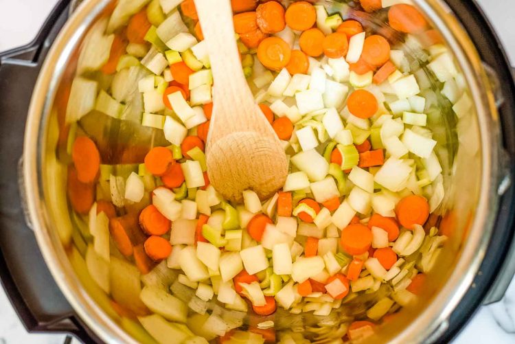 carrots, onions, and celery in an instant pot pressure cooker
